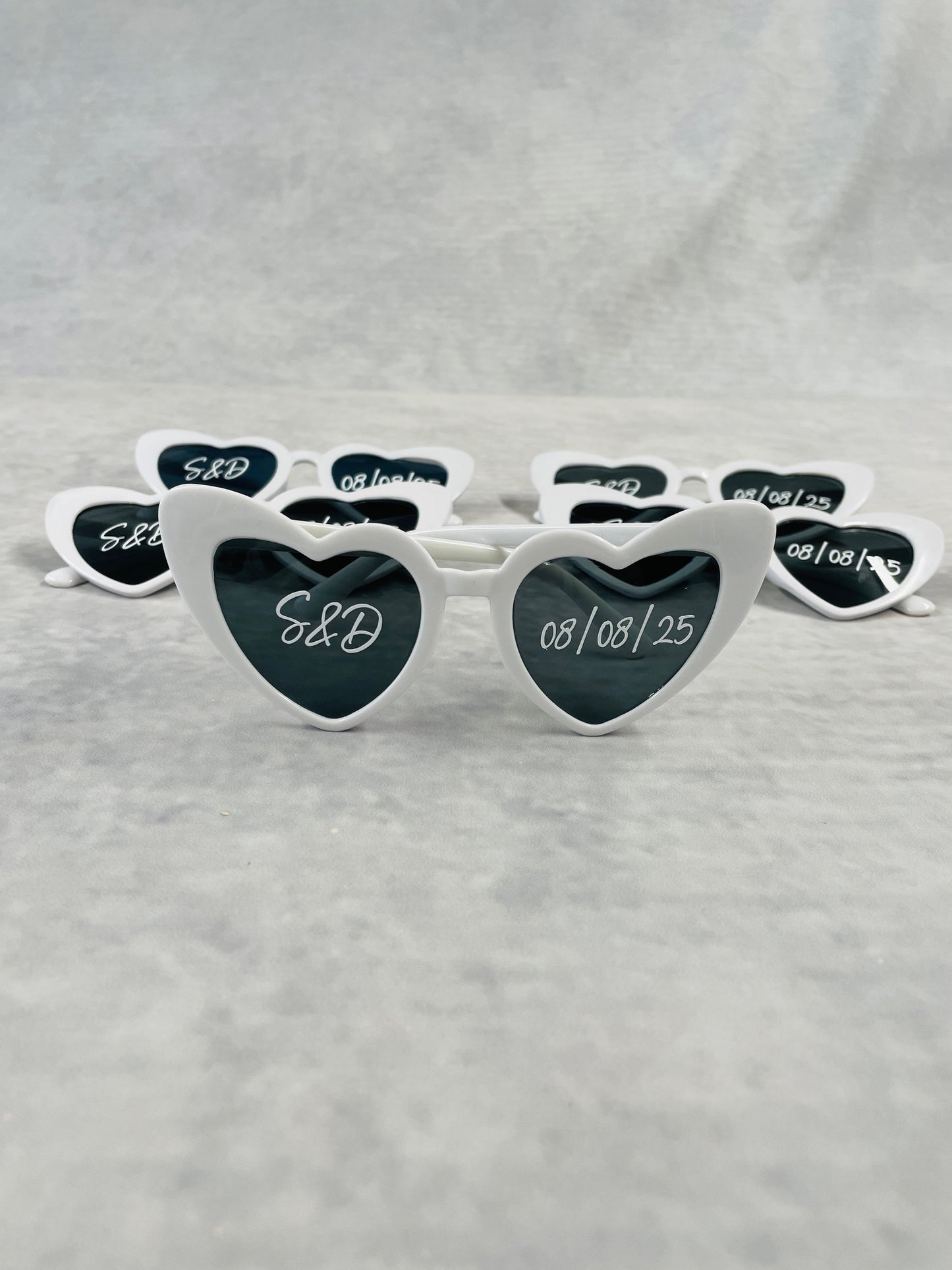 Personalised White heart sunglasses, perfect photo prop for the wedding day, customised with couples initials and wedding date.
